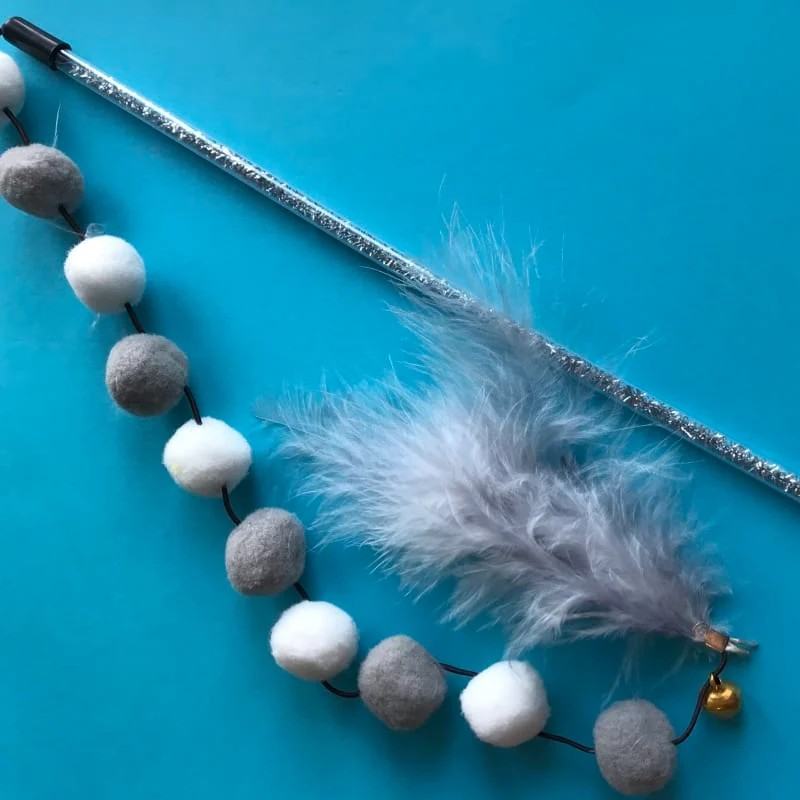 Wand Toy with fluffy pompom balls and feathers